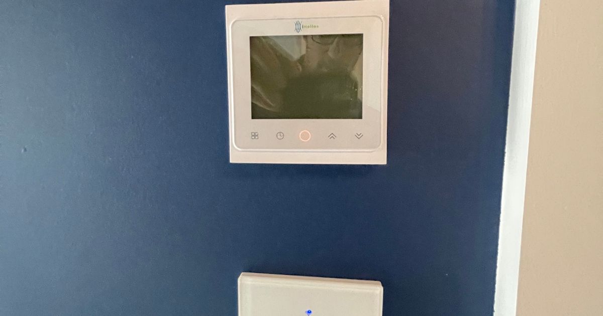 Smart thermostat controlling infrared heating in a converted residential unit.